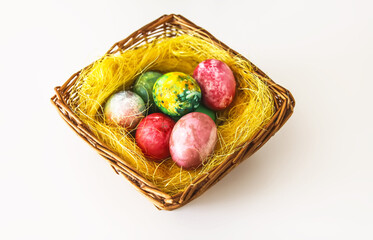 Colorful Easter eggs. Traditional Easter food and decoration in the basket.