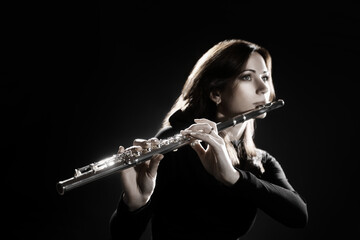 Flute player. Flutist playing flute music instrument - 765966832