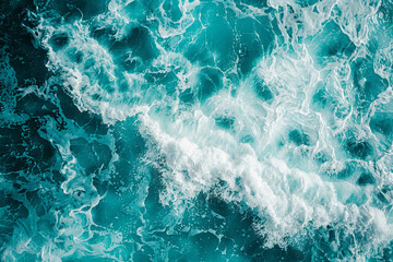 From above aerial view of turquoise ocean water with splashes