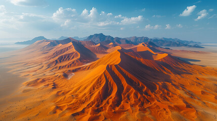 Aerial shot of giant sand dunes in the desert. 