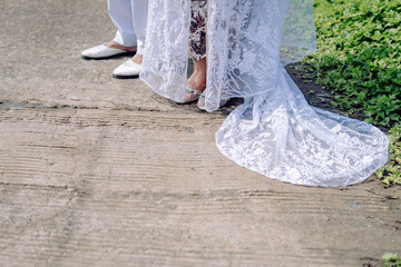 bride and groom walking in the street