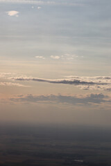 Fototapeta na wymiar sunset over land from an airplane,