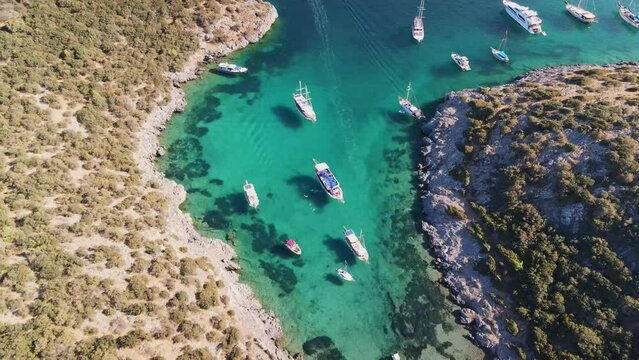 Serene Afternoon Sailing in Bodrum, Turkey: Aerial View of Boats in a Tranquil Cove