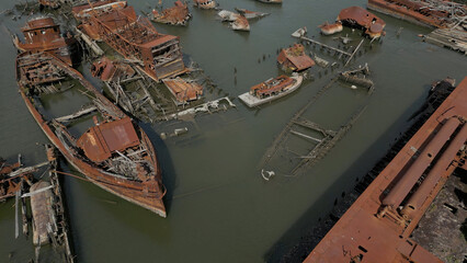 Remains of ship vessels disintegrating in harbor
