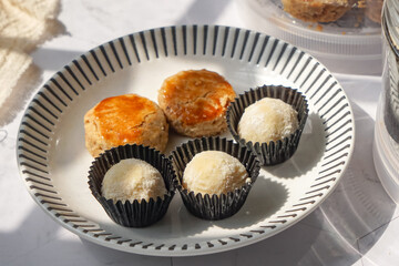 Popular cookies in Malaysia during celebration of Eid Mubarak (Hari Raya) on white background and selective focus.
