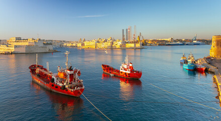 Red tanker ships on the roadstead of Valletta on a sunny morning. - 766002084