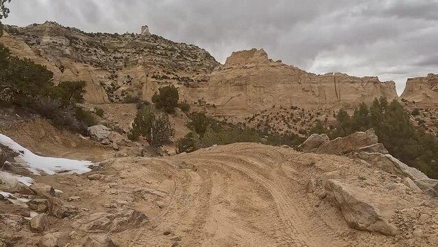 Driving off road rock mountain desert Utah 2. Off road sport and recreation. San Rafael Swell geologic landscape southern Utah. Sandstone rocks into valleys, canyons, gorges and mesas.