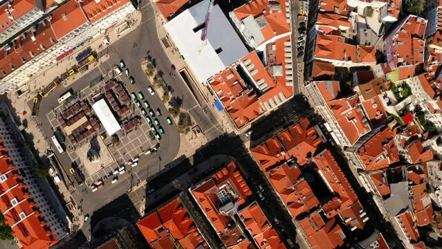 Aerial Top Backward Shot Of Full Frame Of Brown Roofed Houses In City On Sunny Day - Lisbon, Portugal