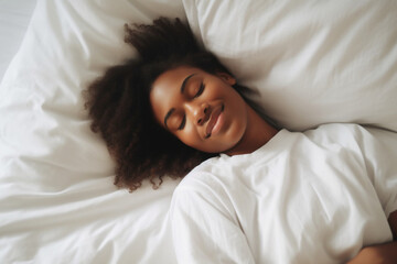 a black woman lies in bed. white linens. dream. cheerful morning. good dream. soft bed. orthopedic mattress - obrazy, fototapety, plakaty