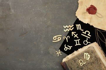 Flat lay composition with zodiac signs on grey textured table. Space for text - Powered by Adobe
