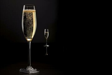 champagne glasses on black background