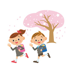 桜の木の前に笑顔で走る子供達