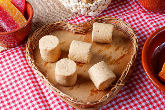 Peanut candy pa&ccedil;oca or pacoca traditional Brazilian sweet based on peanuts on a rustic wooden table