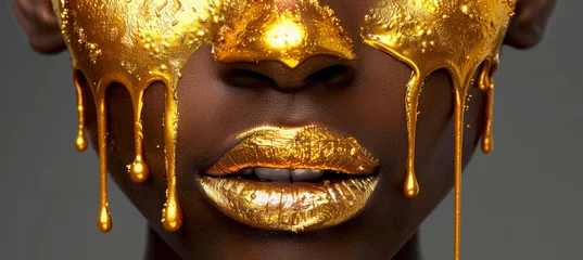 Tapeten Gilded makeup dripping on model s lips, nails, and skin for a luxurious golden look © Ilja