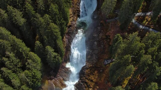 Aerial view of Krimml Waterfalls on sunny day. High Tauern National Park, Austrian Alps, Austria, 4k