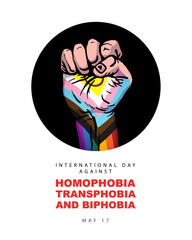 Human hand clenched into a fist in the colors of the LGBT flag. May 17 - the International Day against Homophobia