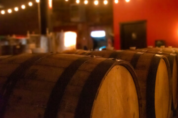 brewery barrels in a taphouse at night