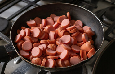 Chopped hot dogs in a pan
