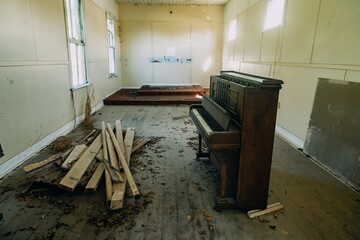 Interior of an abandoned church with a piano. Bay of Plenty, New Zealand.