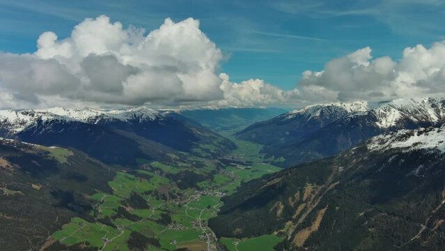 Aerial view of village in valley and mountain in Austrian Alps, Austria, panorama 4k