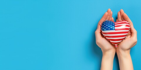 Hands gently holding a heart-shaped American flag ornament, symbolizing love and patriotism.