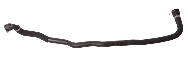 Black plastic hose of the car engine cooling system on a white isolated background in a photo...