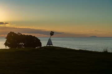 Trig station on a hilltop looking out to White Island, Bay of Plenty, New Zealand.