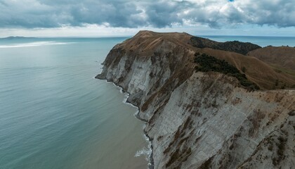 The rocky coastline and ocean headland of Young Nicks Head in Poverty Bay,, Gisborne, New Zealand....