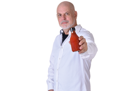portrait of charming man holding glass of white pepper with gray beard smiling