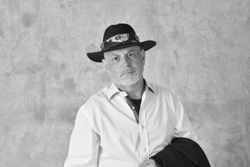 portrait of charming man in black suit white gray beard smiling