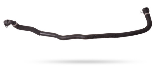 Black plastic hose of the car engine cooling system on a white isolated background in a photo...