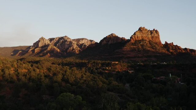 Drone shot pulling away from Snoopy Rock at sunset.