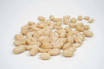 Group of roasted peeled peanuts isolated background
