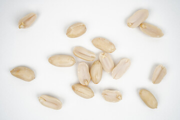 Group of roasted peeled peanuts isolated background