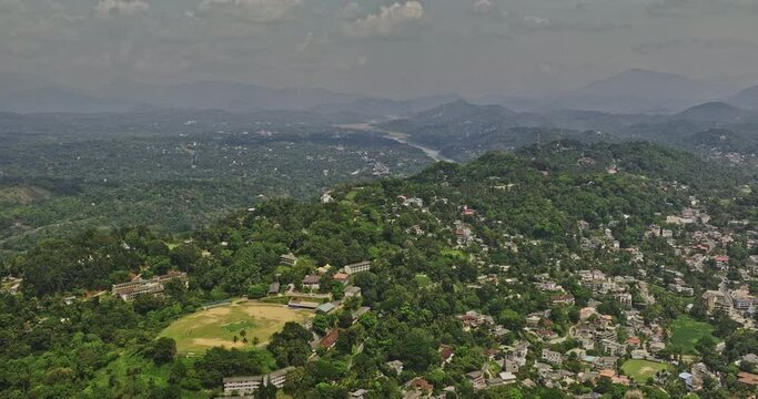 Kandy Sri Lanka Aerial v12 drone flyover Buwelikada hillside capturing Sirimalwatta village town and expansive landscape of lush greenery and mountainous ranges - Shot with Mavic 3 Cine - April 2023