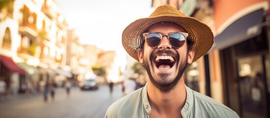 A man with a hat and sunglasses is chuckling while walking on a bustling city street, showcasing his stylish eyewear and sun hat - obrazy, fototapety, plakaty
