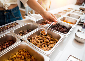 Young woman in the workshop during a lesson on making handmade chocolates and sweets