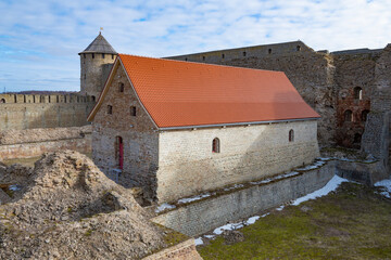 The restored building of the Small Powder Granary on a March day. Ivangorod Fortress - 766122247
