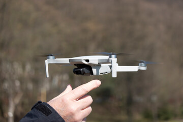 Remotely controlled drone with camera system in full operation