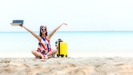 Lifestyle freelance woman raise arms relax after using laptop working on the beach. Asian people success and together your work pastime and meeting conference on internet in holiday