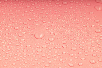 pink surface with water droplets