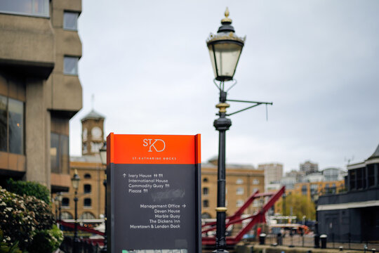 LONDON, UK - MARCH 19, 2024:  Tourist information board at St Katharine Docks, a former dock and now redeveloped into a housing and leisure complex 