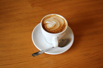 A cup of hot aromatic coffee. Vector illustration .