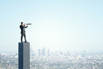 Side view of young businessman on concrete bar looking into the distance with telescope. Bright blue sky and city background. Strategy, forecast and goal concept. Mock up place for advertisement. - obrazy, fototapety, plakaty
