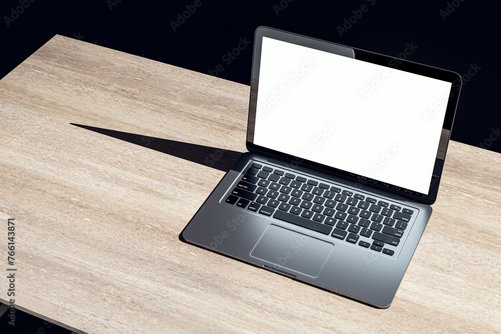 Poster top view of dark designer office workplace with white mock up laptop on wooden desk. 3d rendering.