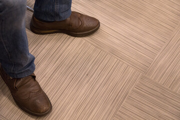 Men's feet in casual walking shoes.