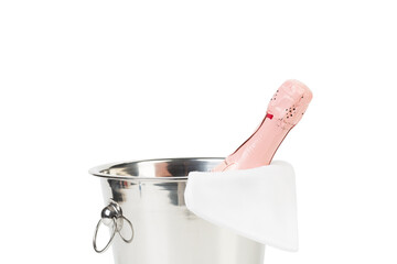 A bottle of champagne in an ice bucket.