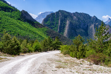Amazing spring landscape in mountainous area. Mountains, valley and road from Gunib to Karadakh in Dagestan, Russia. Wonderful nature, beautiful natural background. Picturesque scenery