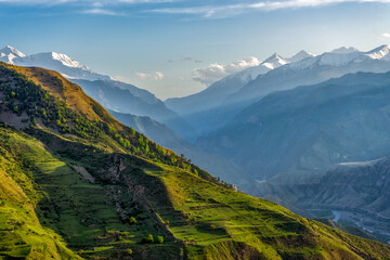 Picturesque mountain spring landscape at sunset. Green mountainside against amazing scenery with...
