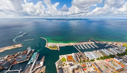 Fotobehang Helsingborg, Sweden. Panorama of the city in summer with port infrastructure. Oresund Strait. Aerial view © nikitamaykov